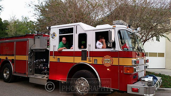 Mark helps out in the fire truck