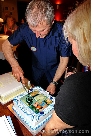 Birthday boy cuts the cake
