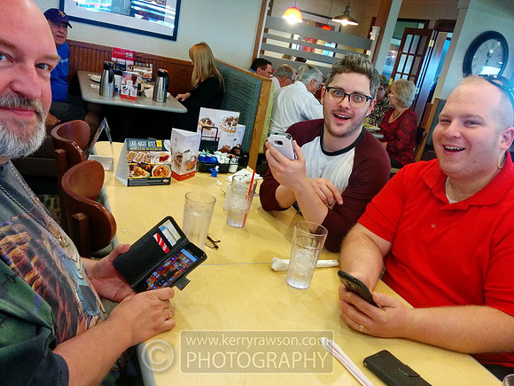 The boys and their phones at breakfast